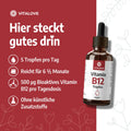 B12 Tropfen Flasche auf rotem Hintergrund